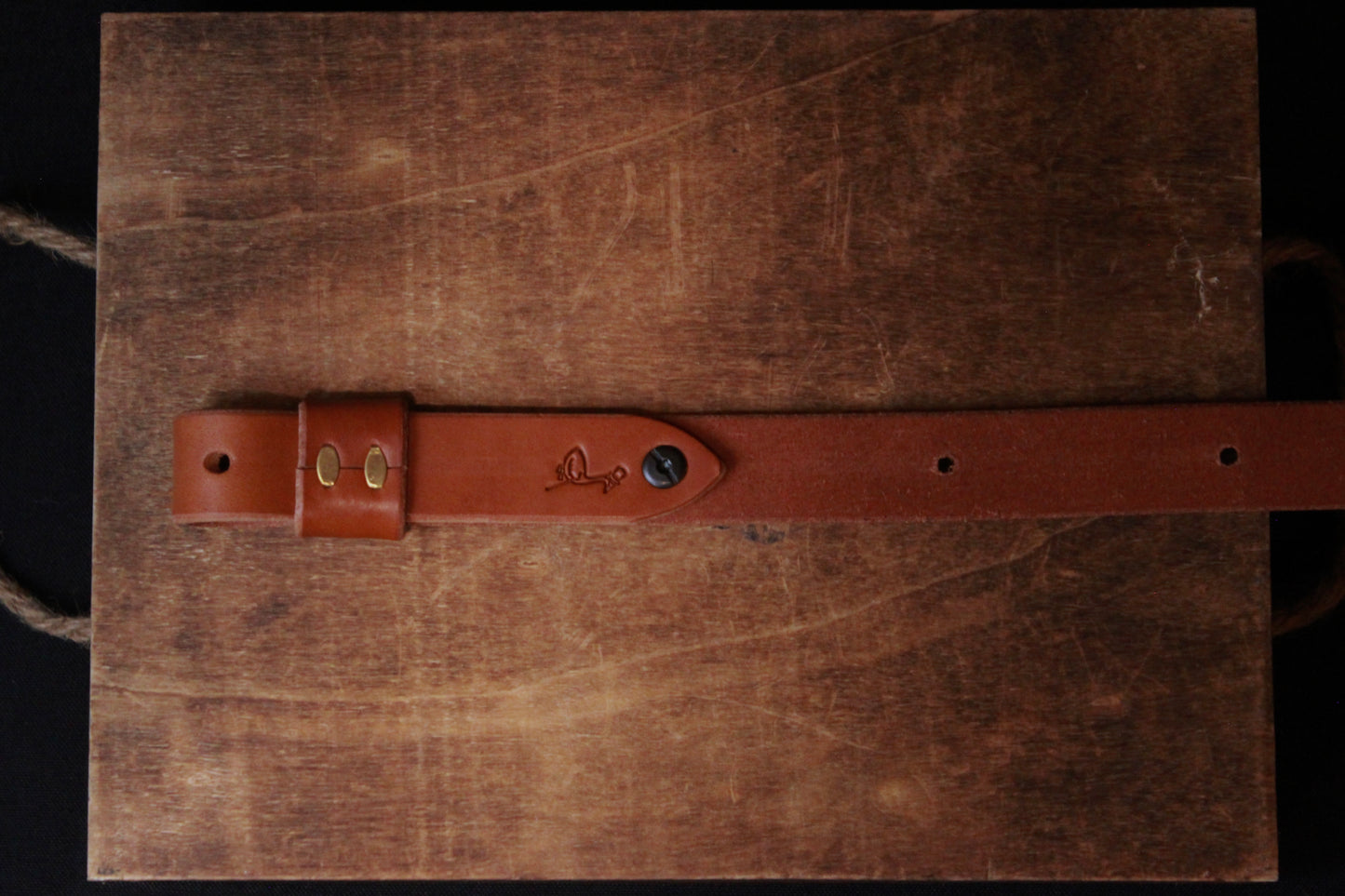 golden brown braided leather gun sling - golden brown braided leather gun strap - above back