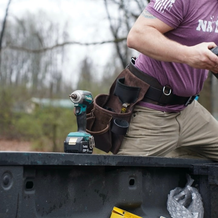 brown leather tool belt, front view on person