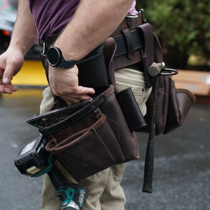 brown leather tool belt, side view on person